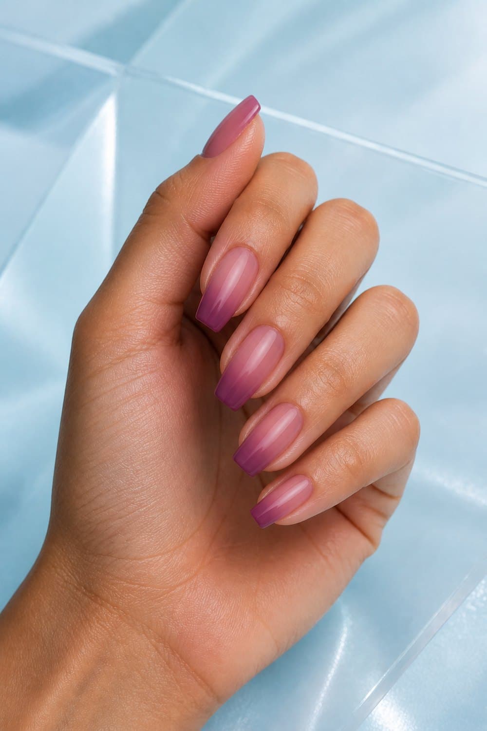 Medium coffin Christmas nails with translucent sugar-plum jelly ombre and a cool glassy shine.