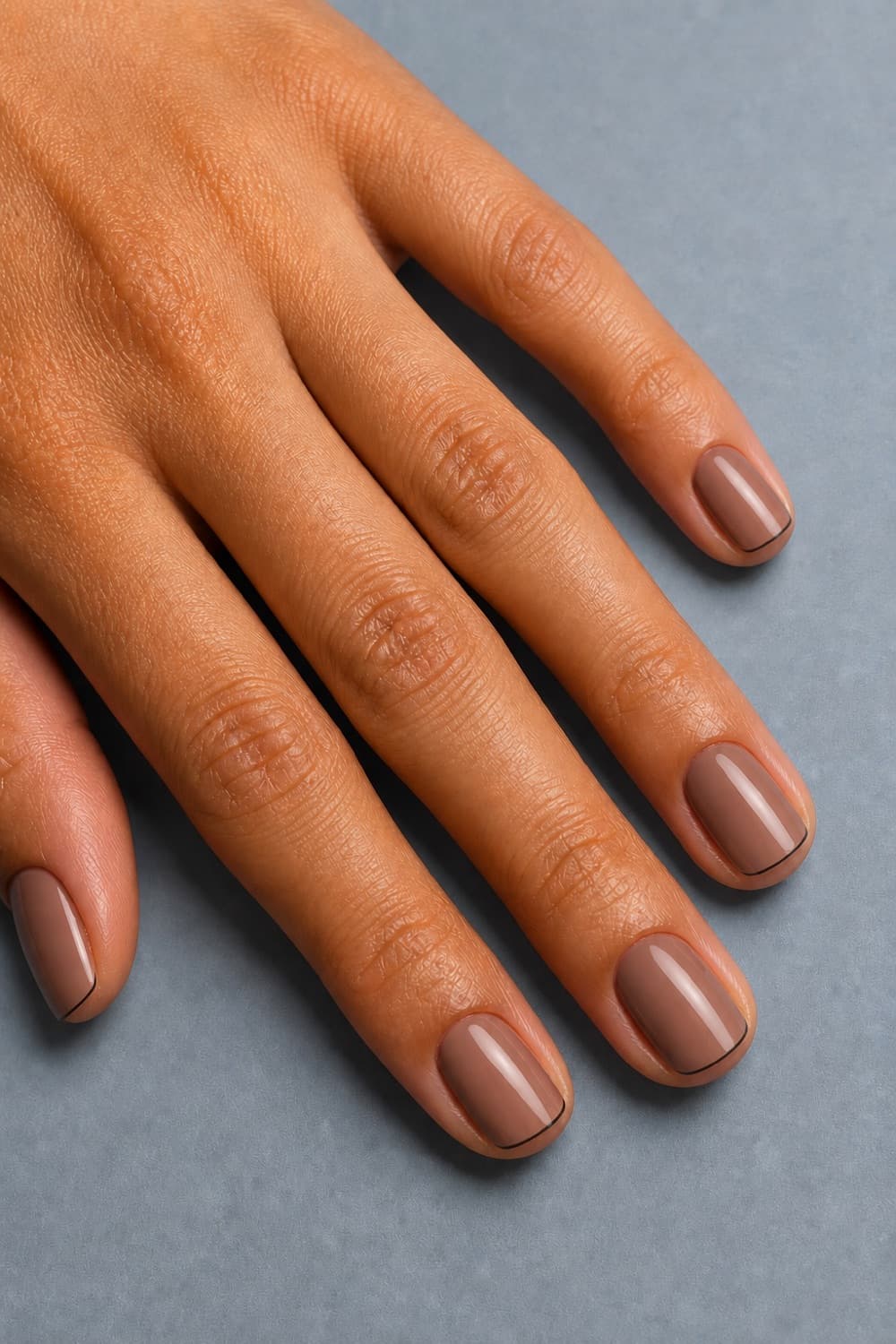 Short square taupe nails with dark espresso micro French tips