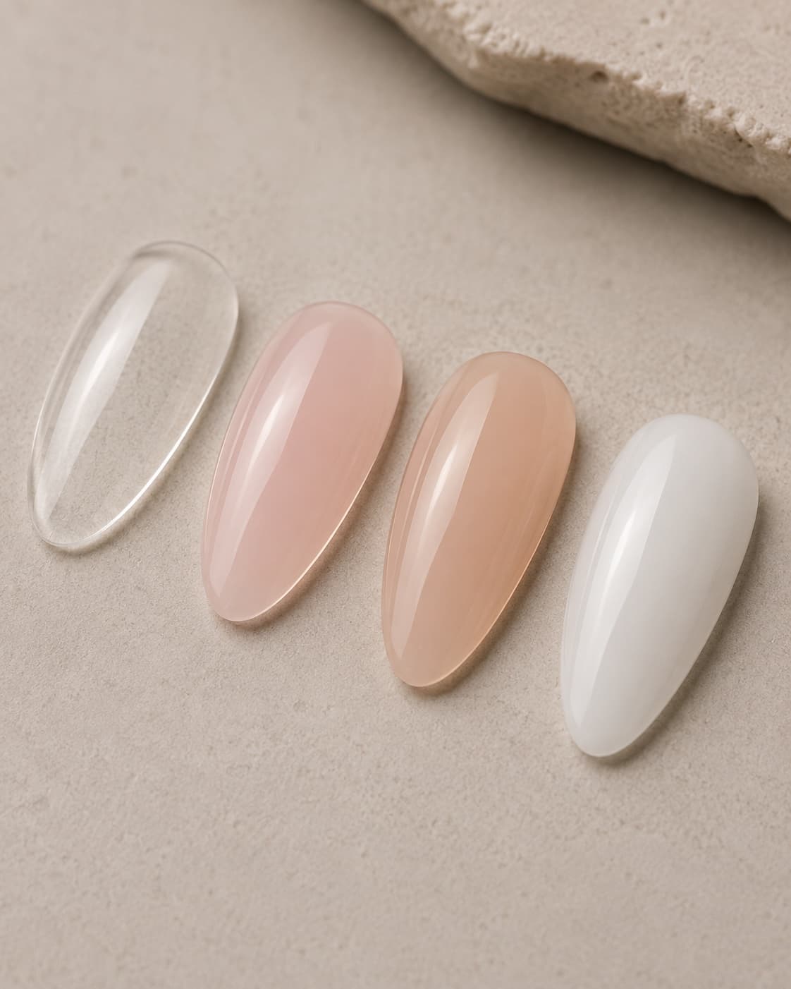 Clear, milky pink, nude beige, and soft white hard gel color samples