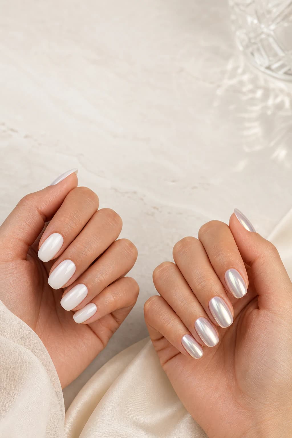 Milky white nails beside glazed pearl chrome nails for a finish comparison
